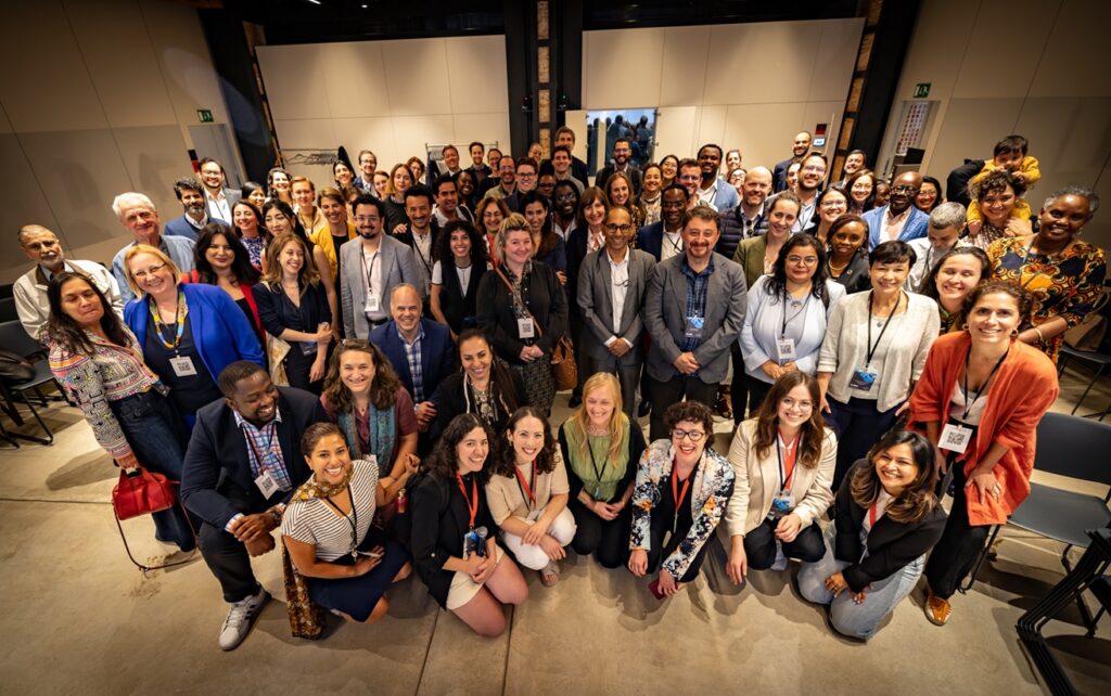 Approximately 100 people pose for the end of conference group photo.