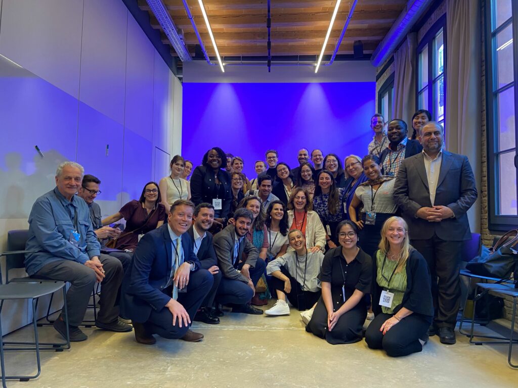 Appoximately 40 people are posed for a group photo at the end of the session.